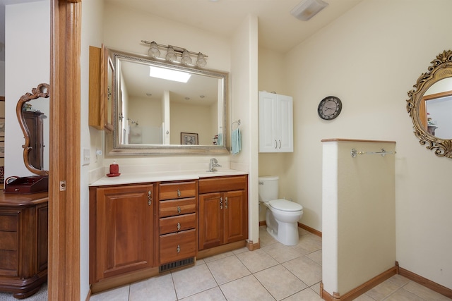 2340 Camaro Cir, Sturgis, SD 57785 - bathroom featuring vanity, toilet, and tile patterned flooring