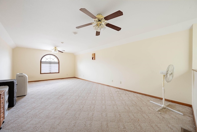 2340 Camaro Cir, Sturgis, SD 57785 - unfurnished living room with carpet, baseboards, a ceiling fan, and vaulted ceiling