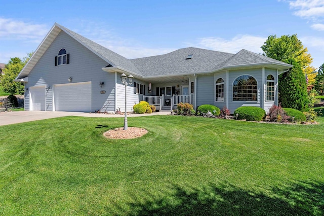 2340 Camaro Cir, Sturgis, SD 57785 - view of front of property with a porch, a front lawn, a garage, and driveway