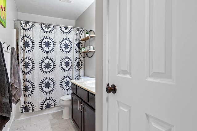 3111 Dry Creek Rd, Rapid City, SD 57703 - bathroom featuring vanity, marble look tile flooring, toilet, and curtained shower