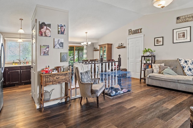 3111 Dry Creek Rd, Rapid City, SD 57703 - living area featuring a chandelier, vaulted ceiling, and wood finished floors