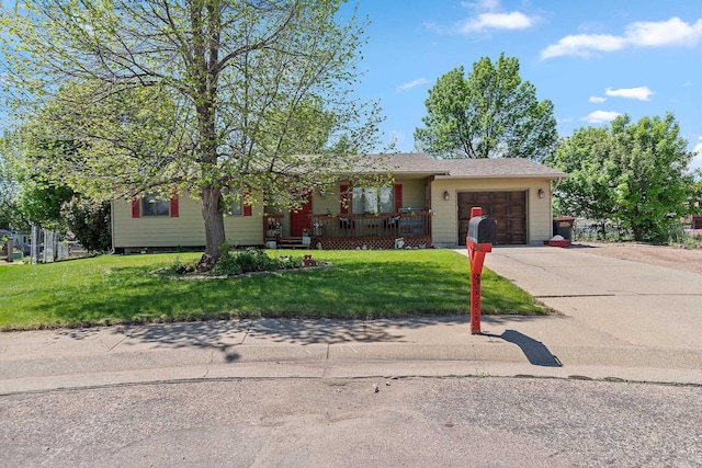 3111 Dry Creek Rd, Rapid City, SD 57703 - ranch-style house featuring a garage, a front lawn, driveway, and covered porch