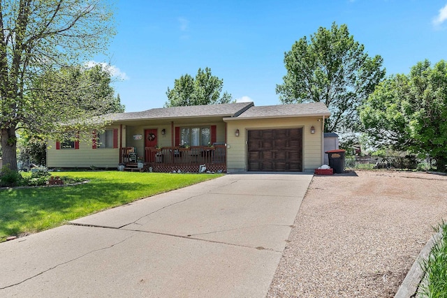 3111 Dry Creek Rd, Rapid City, SD 57703 - ranch-style house featuring a porch, a garage, a front lawn, and driveway