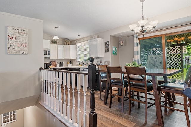 3111 Dry Creek Rd, Rapid City, SD 57703 - dining area with a chandelier and wood finished floors