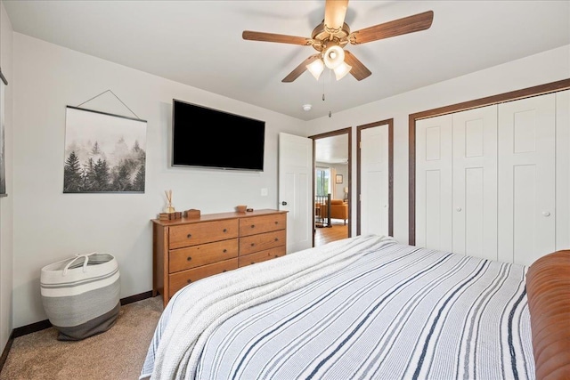 2307 Colorado Dr, Sturgis, SD 57785 - bedroom with a closet, light carpet, baseboards, and ceiling fan