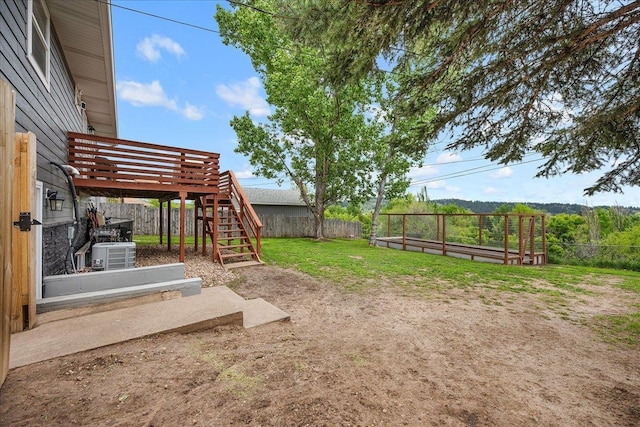 2307 Colorado Dr, Sturgis, SD 57785 - view of yard with stairs, a wooden deck, and central AC unit