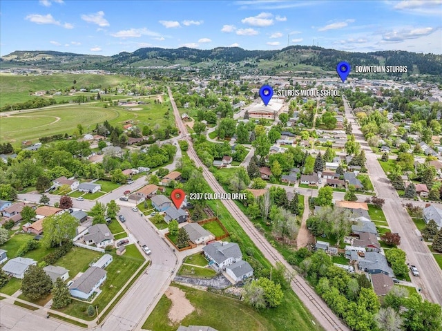 2307 Colorado Dr, Sturgis, SD 57785 - aerial overview of property's location featuring nearby suburban area and a mountain backdrop