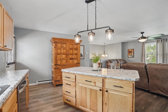4425 Bronco Ln, Rapid City, SD 57701 - kitchen with baseboard heating, light brown cabinetry, wood finished floors, ceiling fan, and dishwasher