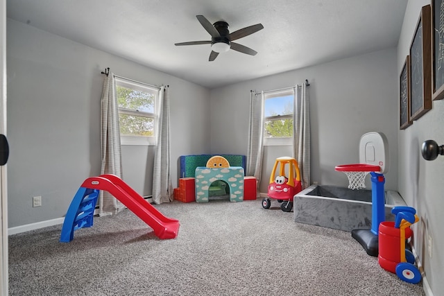 4425 Bronco Ln, Rapid City, SD 57701 - game room featuring carpet flooring, a ceiling fan, and baseboards