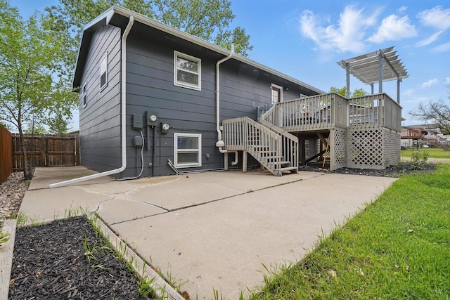 4425 Bronco Ln, Rapid City, SD 57701 - rear view of property with a deck, stairway, and a patio