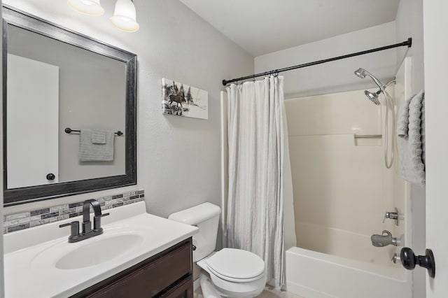 4425 Bronco Ln, Rapid City, SD 57701 - full bathroom featuring vanity, shower / bath combo, toilet, and backsplash