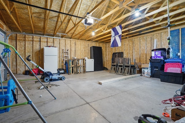 4425 Bronco Ln, Rapid City, SD 57701 - garage with freestanding refrigerator and a garage door opener