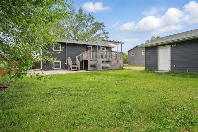 4425 Bronco Ln, Rapid City, SD 57701 - rear view of house with a wooden deck, a pergola, a patio, and a lawn