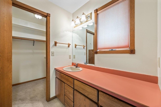 614 Englewood Ct, Spearfish, SD 57783 - bathroom with vanity and baseboards
