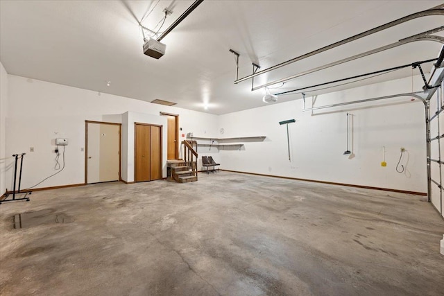 614 Englewood Ct, Spearfish, SD 57783 - garage featuring a garage door opener and baseboards