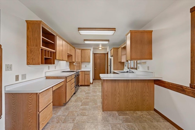 614 Englewood Ct, Spearfish, SD 57783 - kitchen with range with electric stovetop, a sink, a peninsula, open shelves, and stone finish flooring