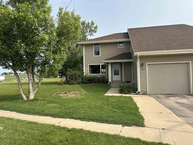 13B Statesboro Dr, Belle Fourche, SD 57717 - view of front of home with a front yard, asphalt driveway, a garage, and a shingled roof