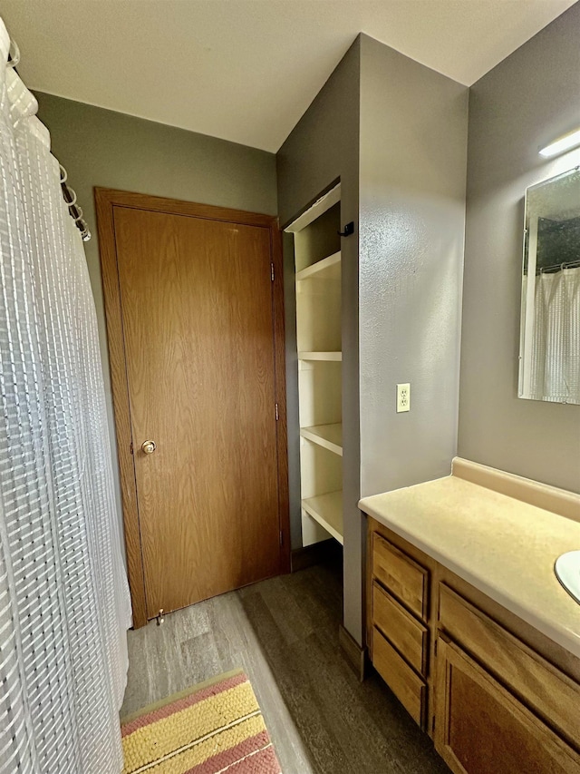 13B Statesboro Dr, Belle Fourche, SD 57717 - bathroom with wood finished floors and vanity