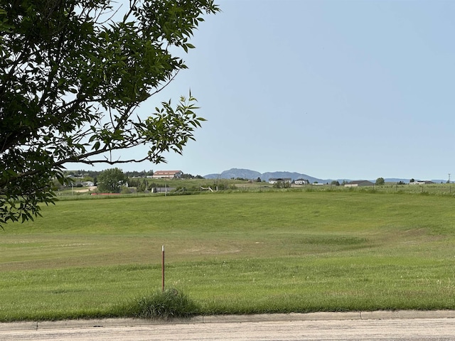 13B Statesboro Dr, Belle Fourche, SD 57717 - surrounding community featuring a yard and a mountain view