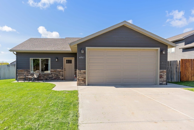 4961 Savannah St, Rapid City, SD 57703 - ranch-style home featuring stone siding, driveway, roof with shingles, and an attached garage