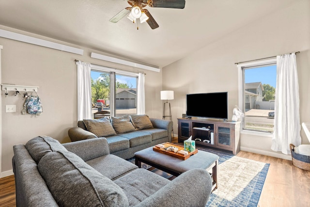 4961 Savannah St, Rapid City, SD 57703 - living area with ceiling fan, vaulted ceiling, wood finished floors, and baseboards