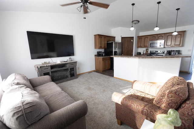 752 Bear Tooth Ct, Box Elder, SD 57719 - living room featuring vaulted ceiling, ceiling fan, light carpet, and baseboards