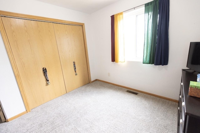 752 Bear Tooth Ct, Box Elder, SD 57719 - unfurnished bedroom featuring carpet floors, baseboards, and a closet