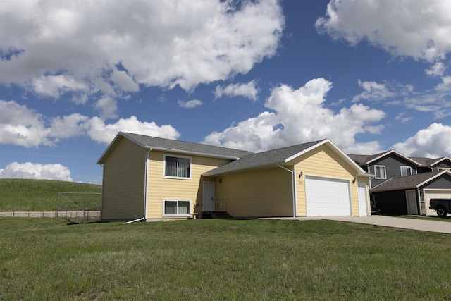 752 Bear Tooth Ct, Box Elder, SD 57719 - view of front of property featuring driveway, an attached garage, and a front lawn