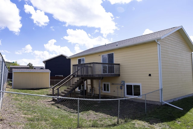 752 Bear Tooth Ct, Box Elder, SD 57719 - rear view of house with stairway and a wooden deck