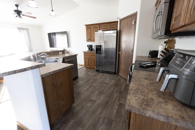 752 Bear Tooth Ct, Box Elder, SD 57719 - kitchen with stainless steel appliances, a sink, lofted ceiling, dark wood-type flooring, and a ceiling fan