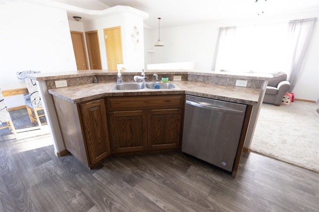752 Bear Tooth Ct, Box Elder, SD 57719 - kitchen featuring dishwasher, a sink, dark wood-style flooring, and a center island with sink