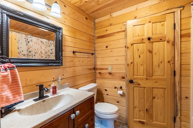 23470 Mineral Ln, Hill City, SD 57745 - bathroom with vanity, toilet, wood walls, wooden ceiling, and a shower with curtain