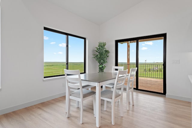 13439 Frontier Loop, Piedmont, SD 57769 - dining space featuring plenty of natural light, light wood finished floors, and baseboards