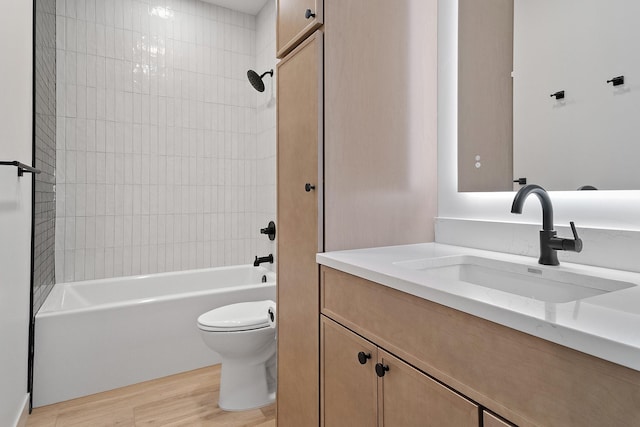 13439 Frontier Loop, Piedmont, SD 57769 - full bathroom featuring toilet, vanity, wood finished floors, and shower / washtub combination