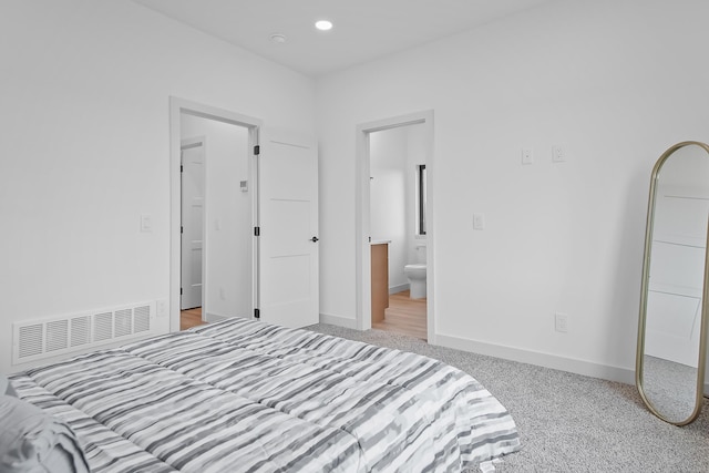 13439 Frontier Loop, Piedmont, SD 57769 - carpeted bedroom with connected bathroom, baseboards, and recessed lighting