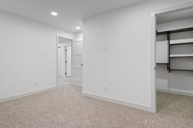 13439 Frontier Loop, Piedmont, SD 57769 - unfurnished bedroom featuring carpet flooring, recessed lighting, a walk in closet, and baseboards