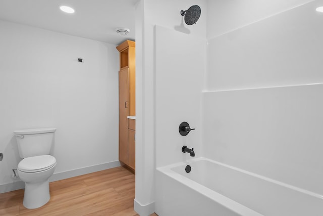 13439 Frontier Loop, Piedmont, SD 57769 - full bath featuring tub / shower combination, toilet, wood finished floors, recessed lighting, and baseboards