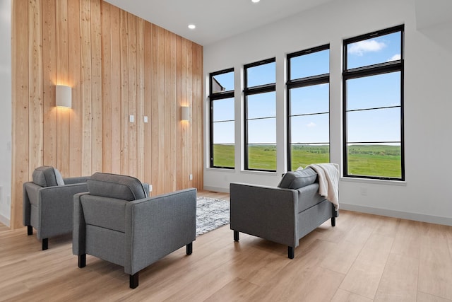 13439 Frontier Loop, Piedmont, SD 57769 - living area with wood walls, light wood-style floors, and recessed lighting