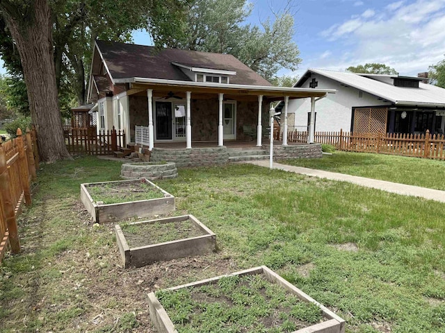 304 6th Ave, Edgemont, SD 57735 - view of front facade with a vegetable garden and stone siding