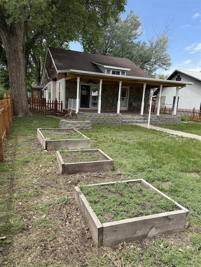 304 6th Ave, Edgemont, SD 57735 - view of front facade with a vegetable garden and stone siding