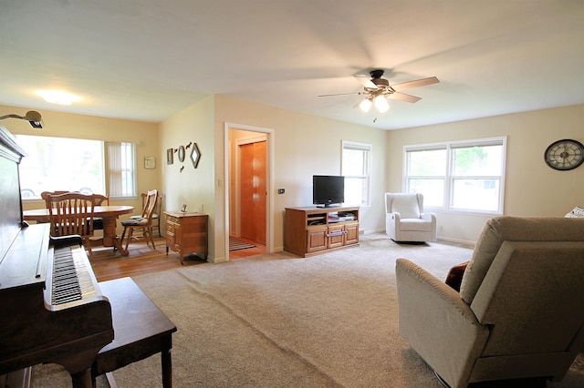 1033 Boulevard St, Sturgis, SD 57785 - living room featuring a ceiling fan, light carpet, and baseboards