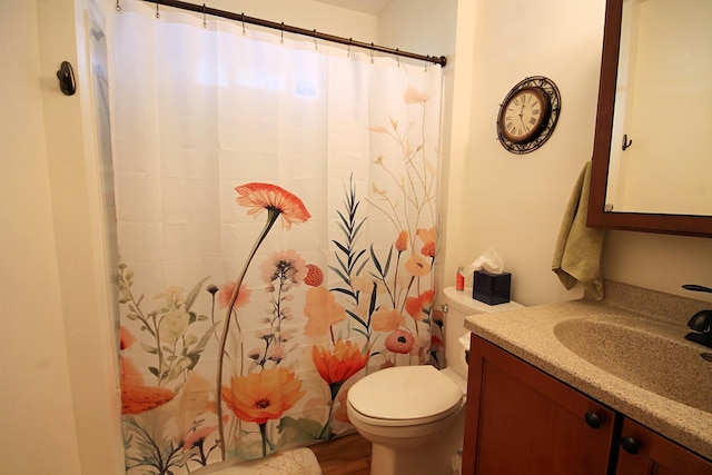 1033 Boulevard St, Sturgis, SD 57785 - full bath featuring vanity, toilet, wood finished floors, and a shower with shower curtain