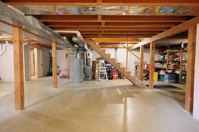 1033 Boulevard St, Sturgis, SD 57785 - unfinished below grade area with stairs, gas water heater, and heating unit