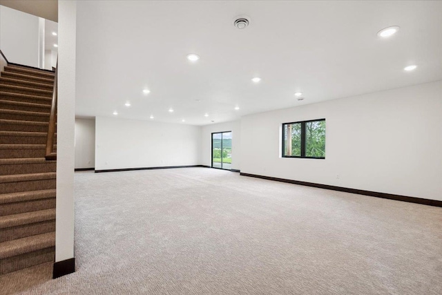 2431 Malibu Loop, Sturgis, SD 57785 - spare room with recessed lighting, light colored carpet, baseboards, and stairway