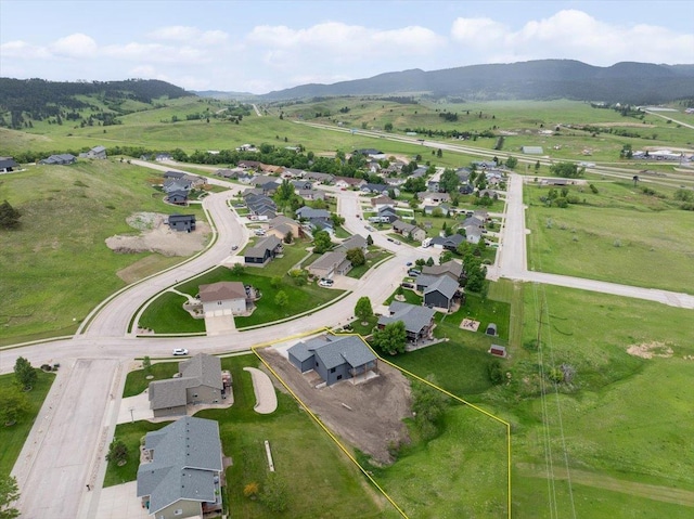 2431 Malibu Loop, Sturgis, SD 57785 - aerial view of property's location featuring a mountain backdrop and property boundaries highlighted