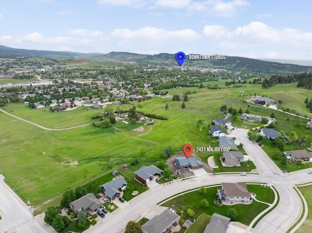 2431 Malibu Loop, Sturgis, SD 57785 - aerial view of property's location with nearby suburban area and a mountainous background