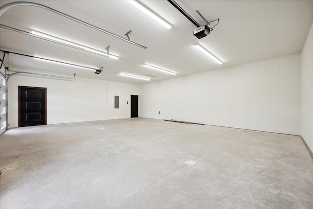 2431 Malibu Loop, Sturgis, SD 57785 - garage featuring a garage door opener and electric panel