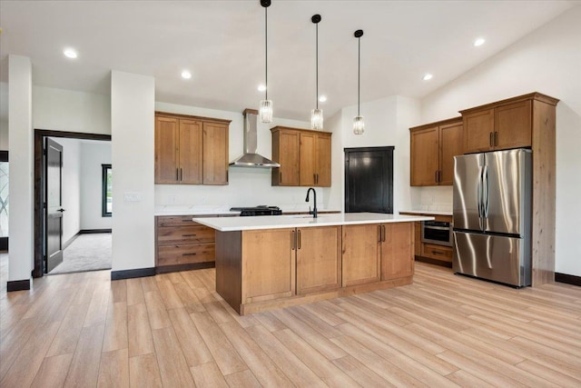 2431 Malibu Loop, Sturgis, SD 57785 - kitchen featuring freestanding refrigerator, wall chimney range hood, light wood-style flooring, brown cabinets, and lofted ceiling