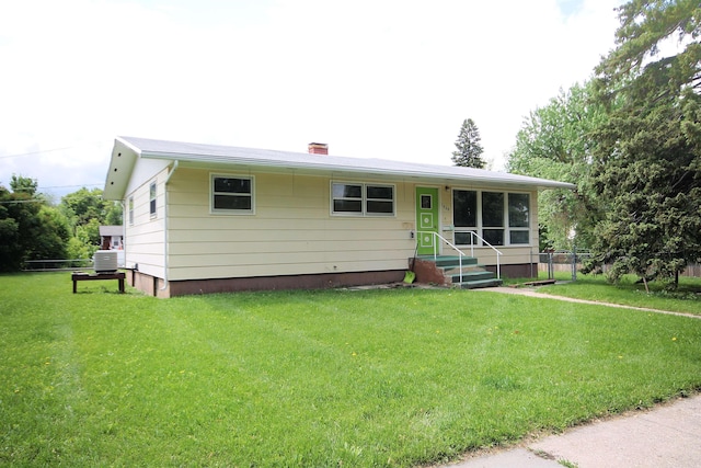 1609 Spruce St, Sturgis, SD 57785 - view of front of house featuring a chimney and central AC unit