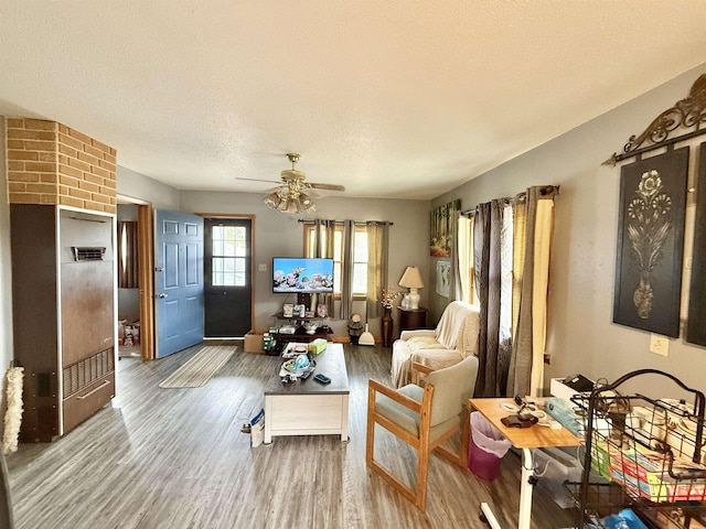 403 Mcquillan Ave, Lead, SD 57754 - living room with wood finished floors, ceiling fan, and a textured ceiling